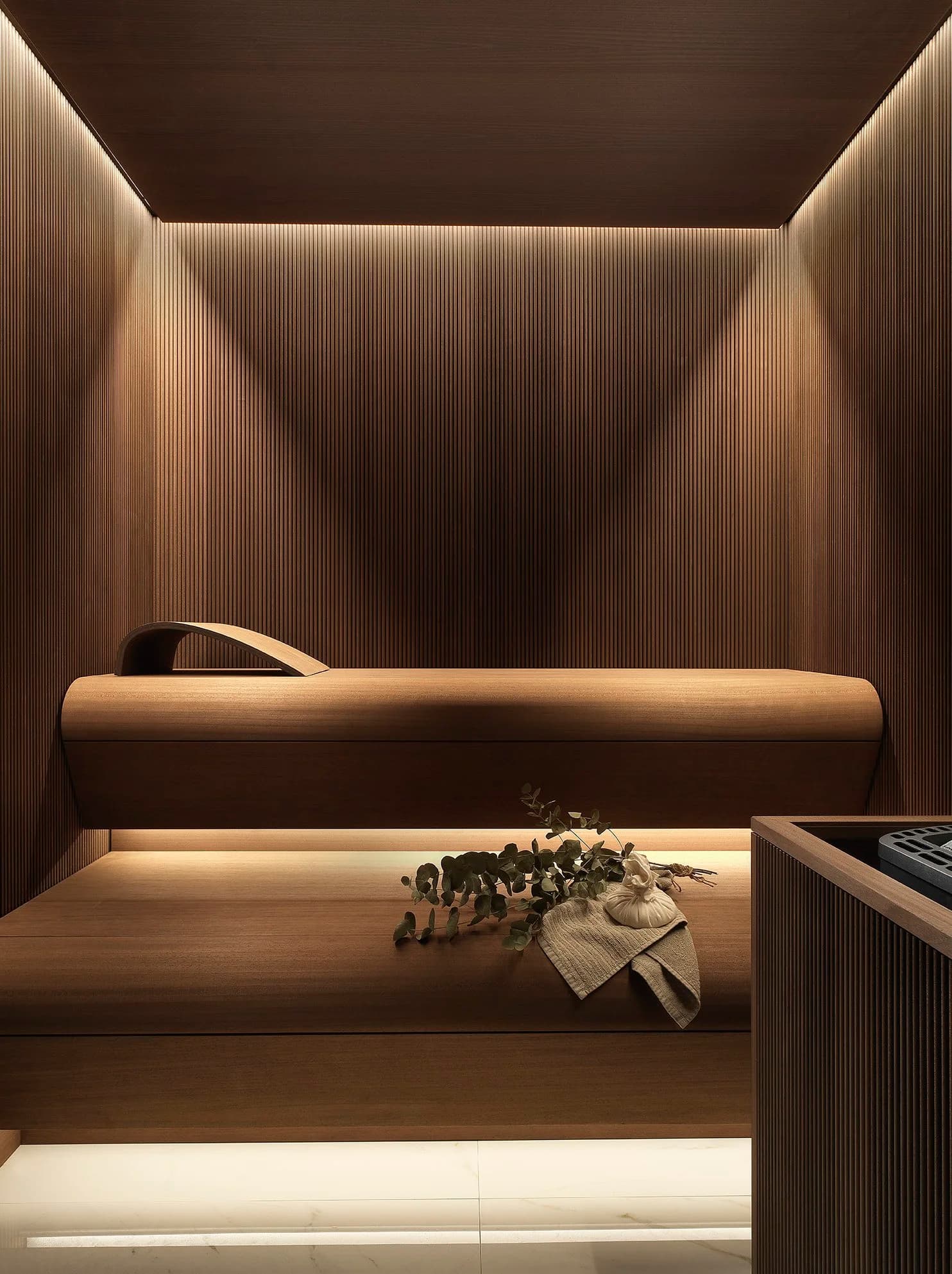 Infinity sauna interior showing thermowood cladding and ergonomic benching